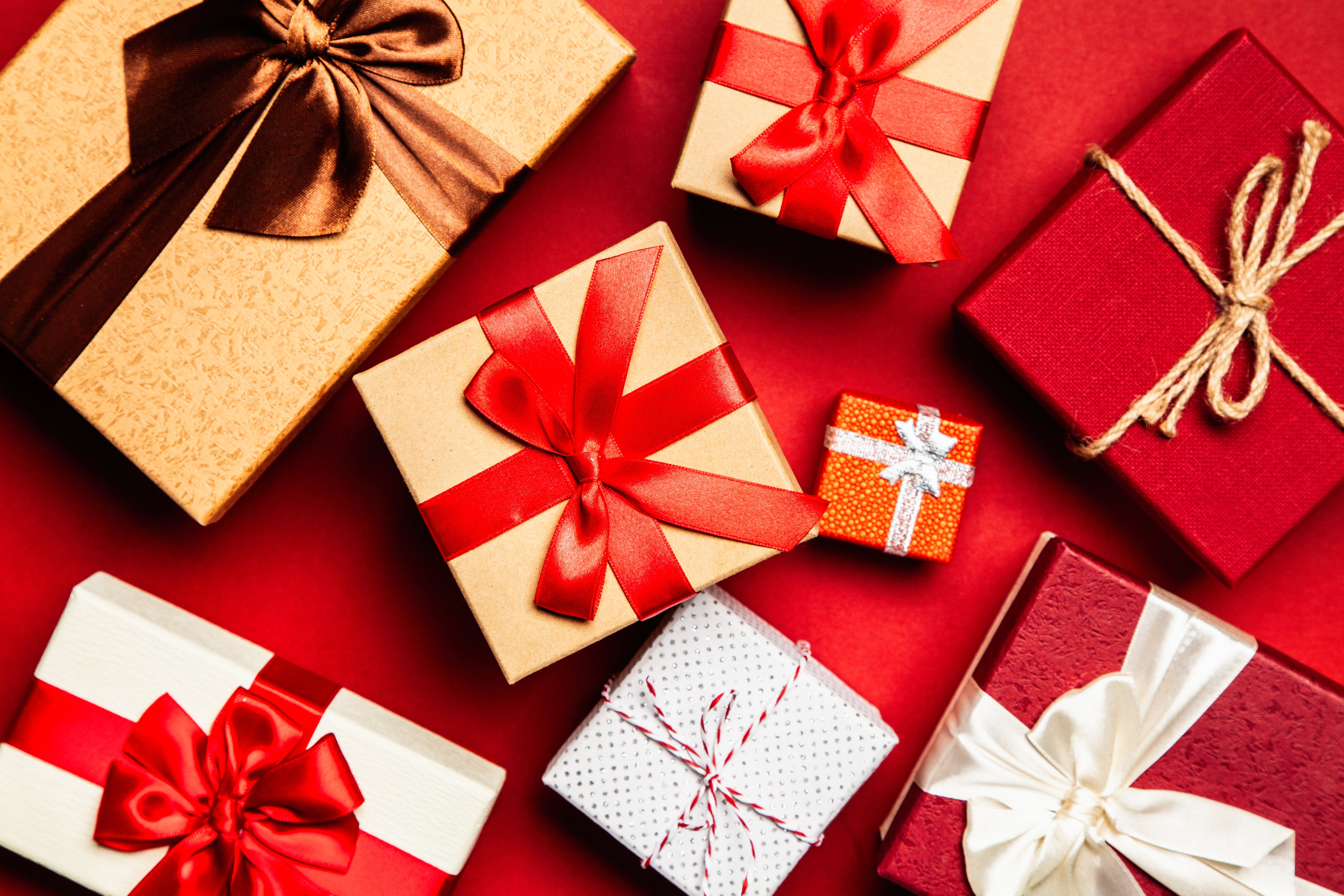 a group of small christmas presents with bows