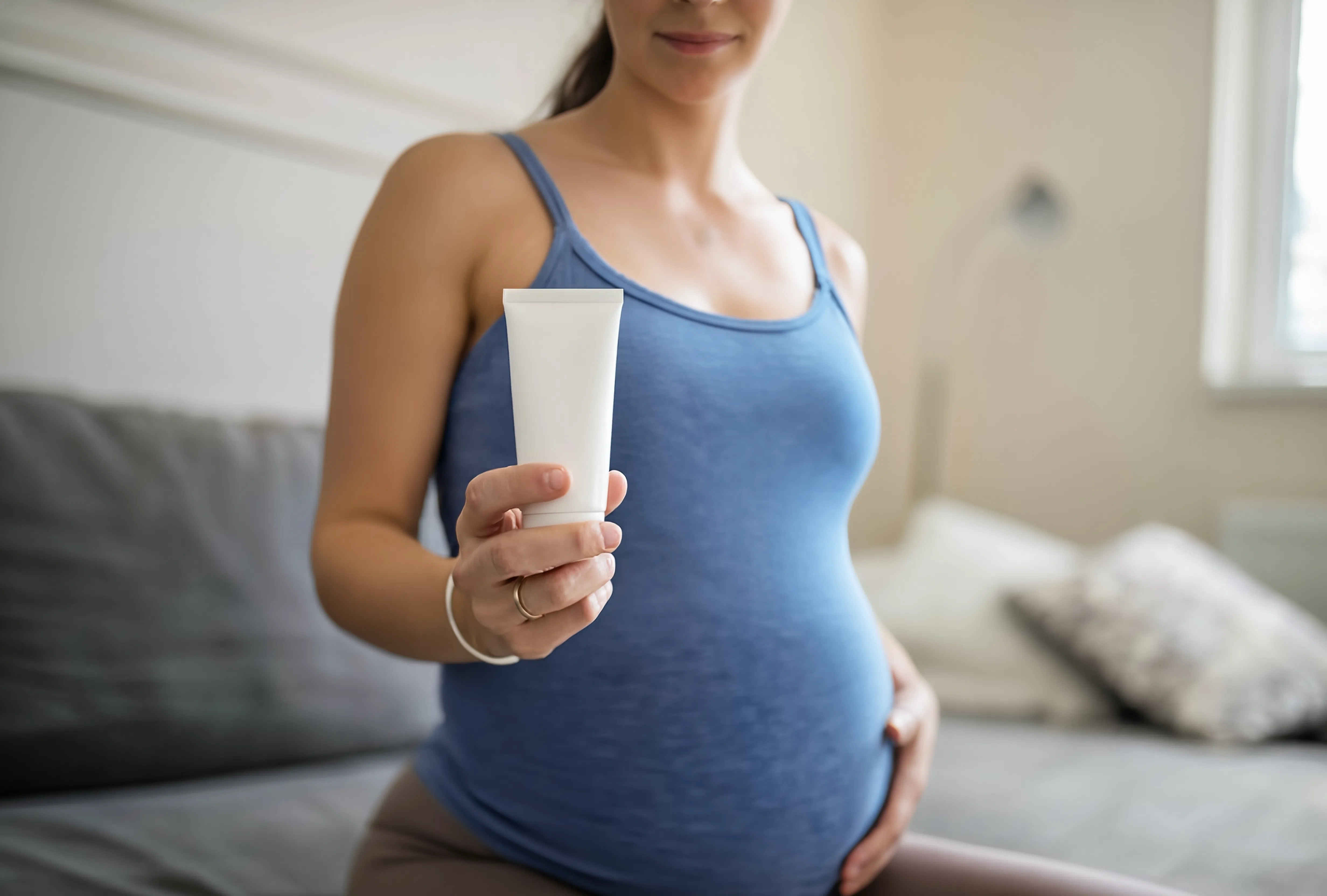 pregnant-woman-holding-a-tube-of-lotion